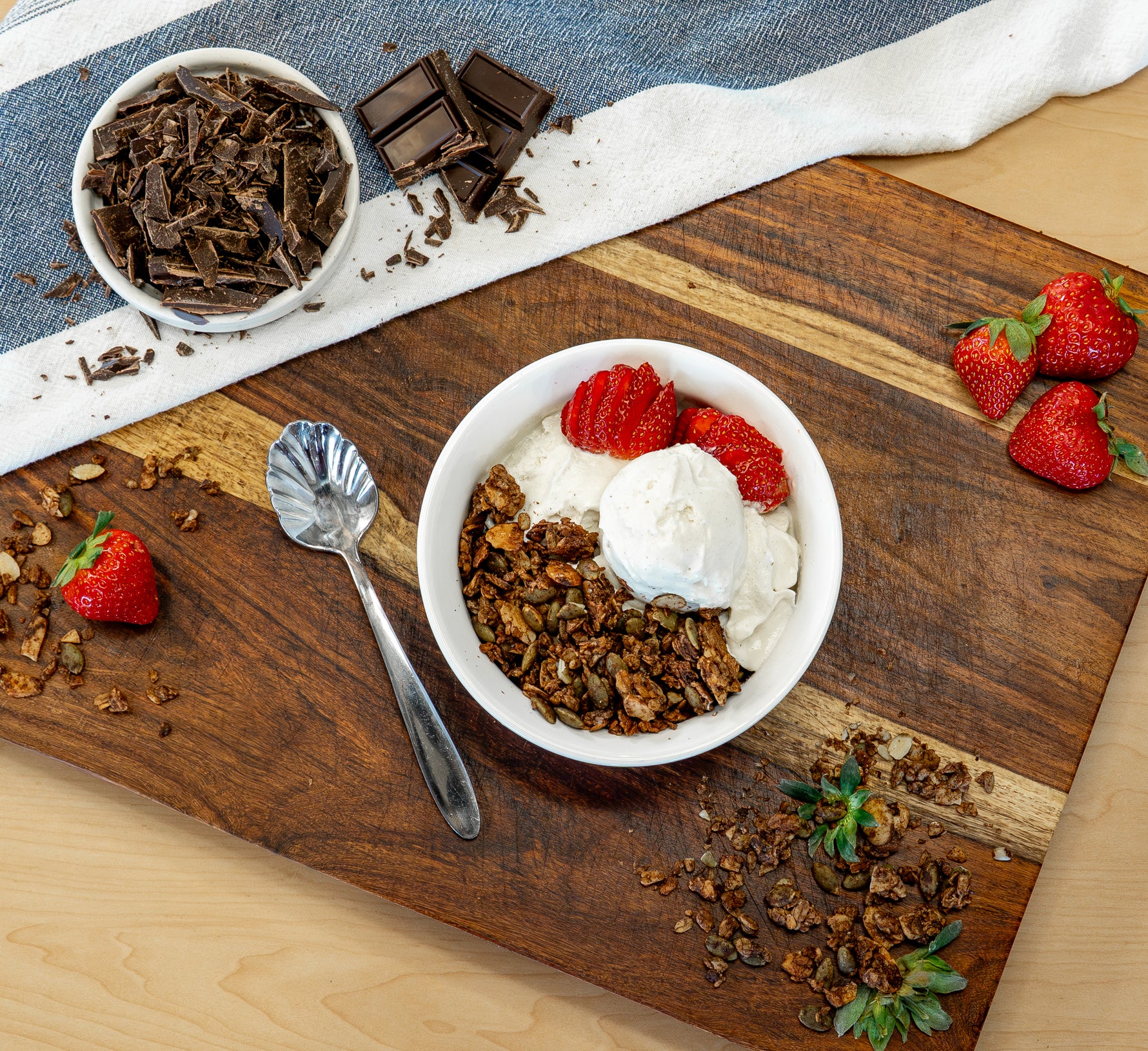 Mexican Chocolate granola served with ice cream and fresh fruit