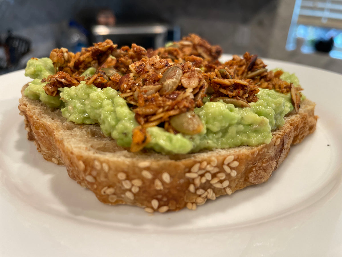 Savory Bloody Mary granola on avocado toast
