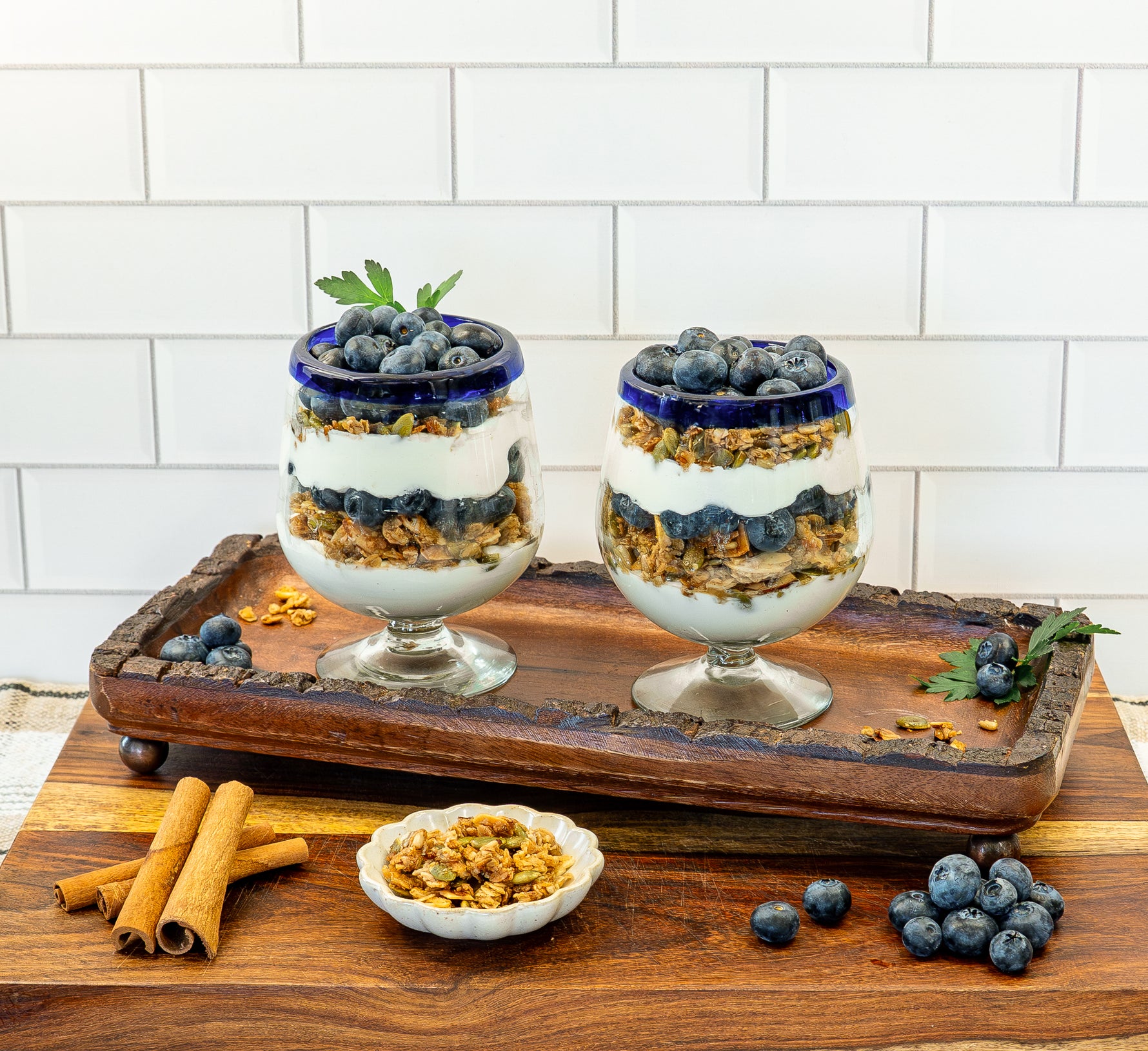 Maple Cinnamon granola layered in yogurt parfait with blueberries