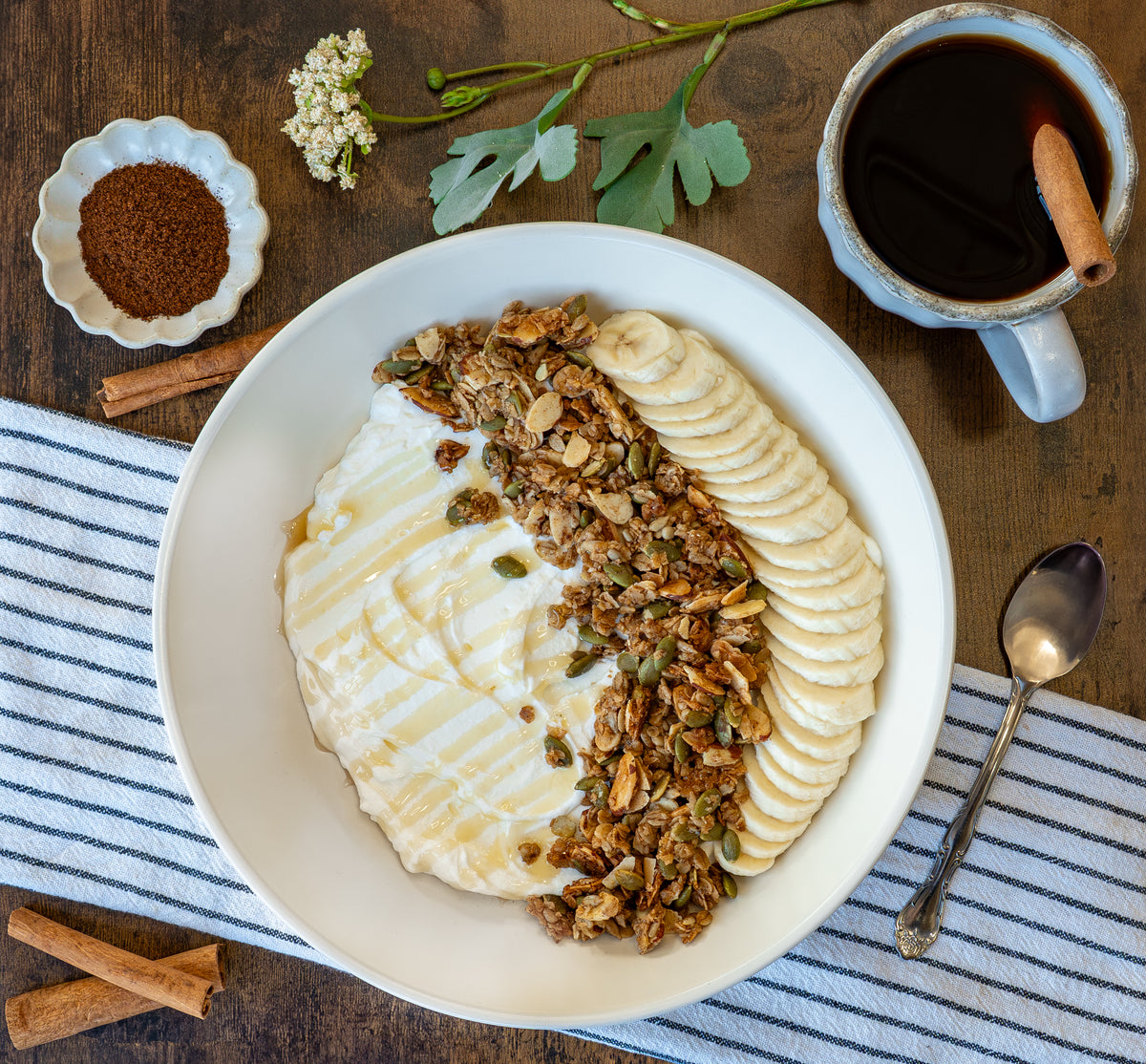 Chai Spiced granola served with yogurt and bananas